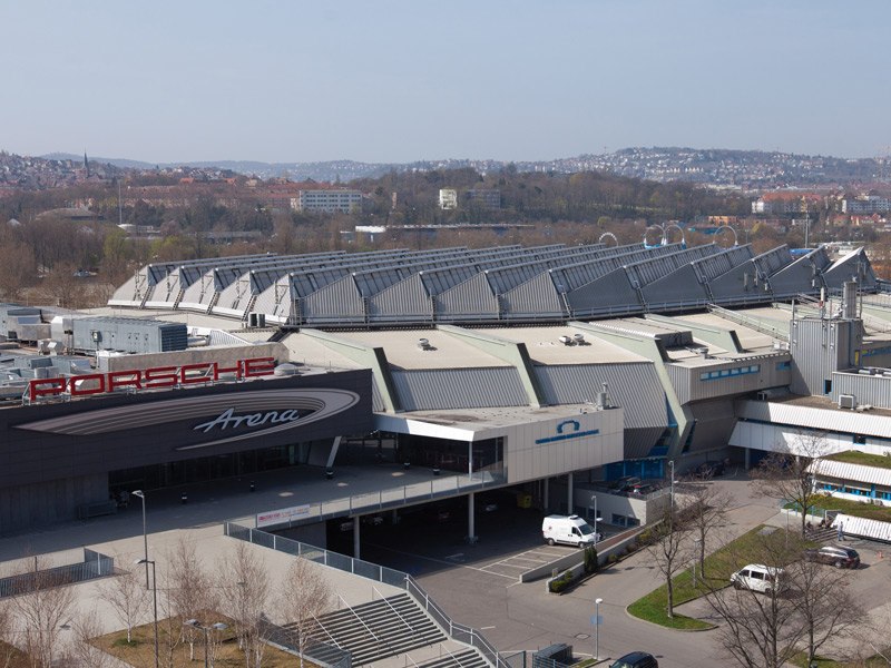 The Porsche-Arena and Hanns-Martin-Schleyer-Halle in Stuttgart, surrounded by trees and cityscape in the background., © www.niedermueller.de The Porsche-Arena and Hanns-Martin-Schleyer-Halle in Stuttgart, surrounded by trees and cityscape in the background., © www.niedermueller.de