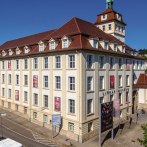 The Linden Museum in Stuttgart in sunny weather. A large, historic building with red roofs and numerous windows., © Stuttgart-Marketing GmbH Achim Mende